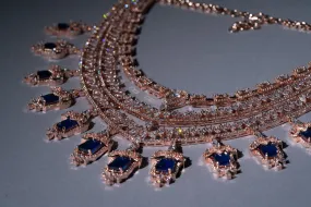 Grace Sapphire Blue Chandelier Statement Necklace Set Designer Rose Gold Plated Fashion Jewelry by Jaipur Rose Indian Jewelry Online