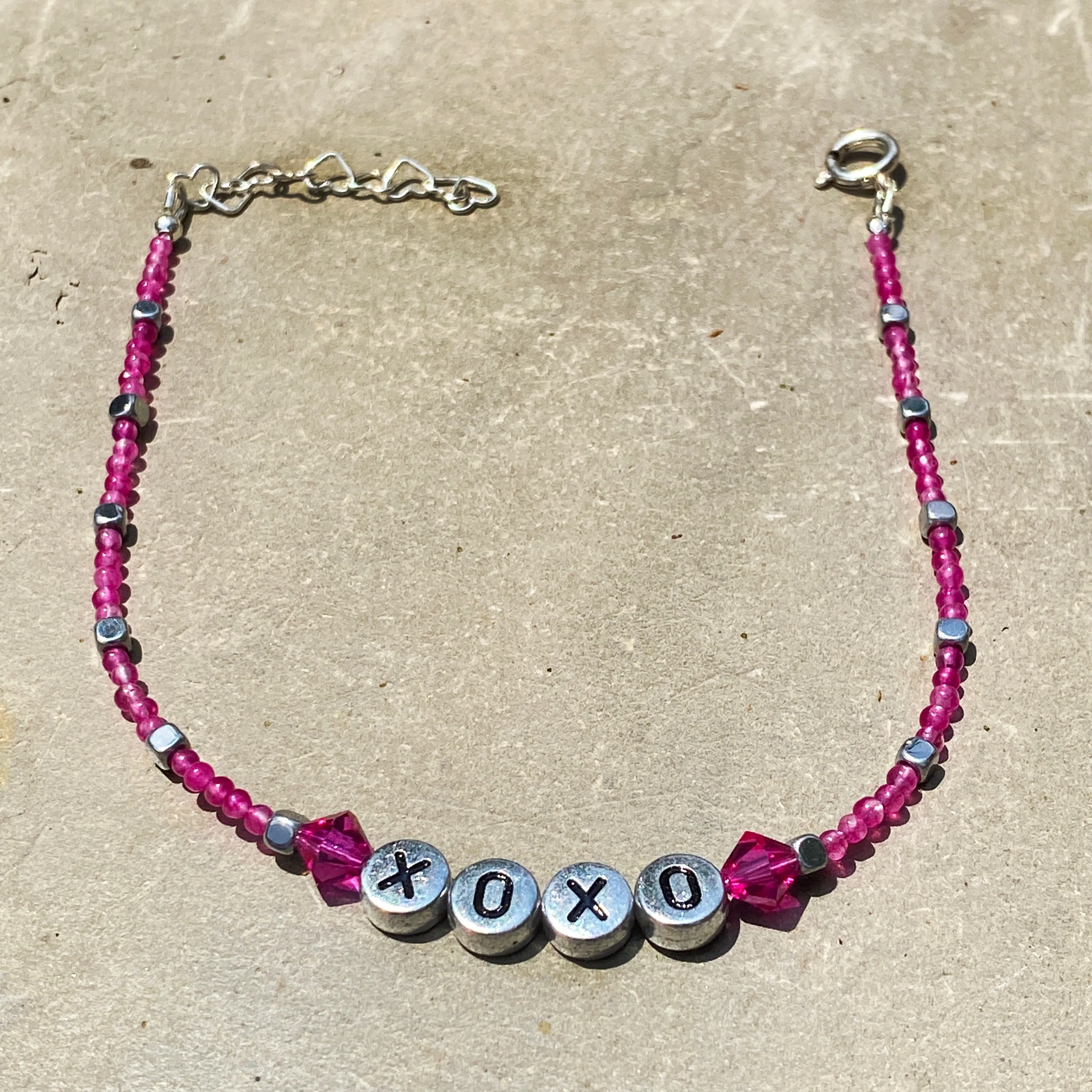 Pink agate, hematite, and Swarovski Crystal “xoxo” sterling silver anklet