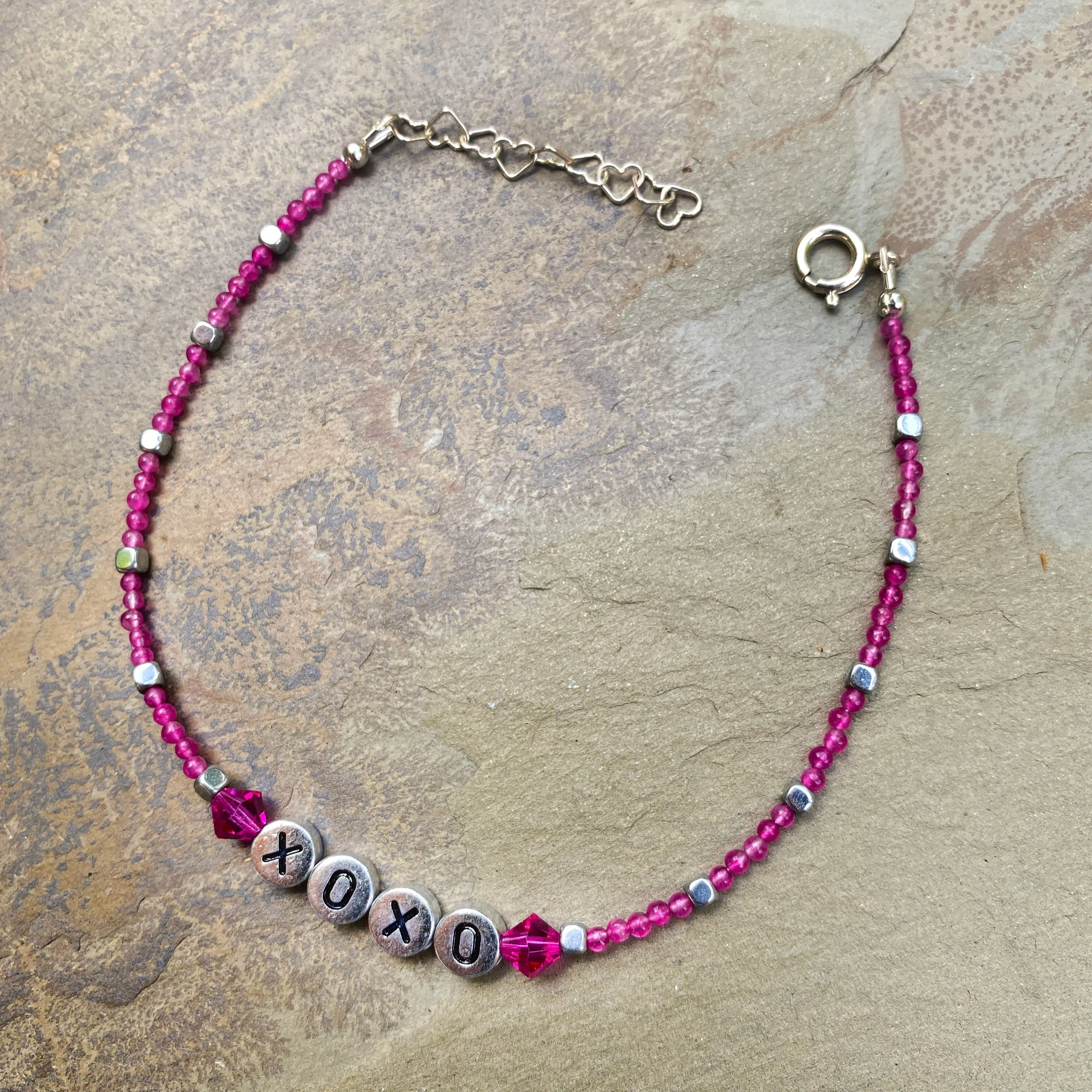 Pink agate, hematite, and Swarovski Crystal “xoxo” sterling silver anklet